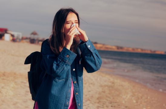 Tourist Girl Blowing her Nose