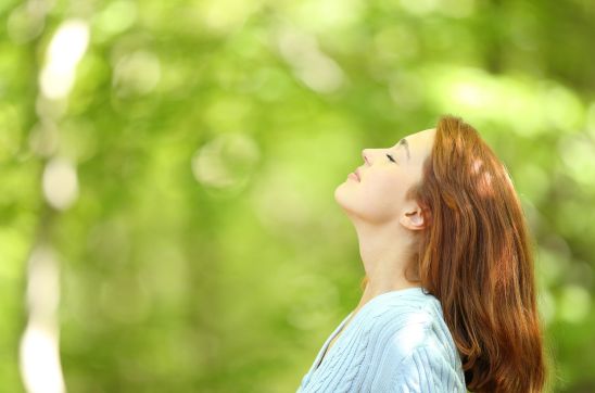 woman breathing fresh air